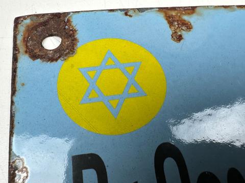 Holocaust Jew Jewish doctor in Ghetto wall sign with yellow STAR OF DAVID Holocaust Jew Jewish doctor in Ghetto wall sign with yellow STAR OF DAVID