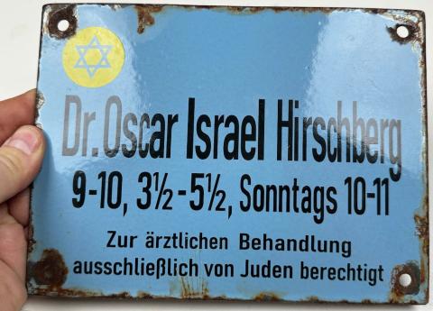 Holocaust Jew Jewish doctor in Ghetto wall sign with yellow STAR OF DAVID Holocaust Jew Jewish doctor in Ghetto wall sign with yellow STAR OF DAVID