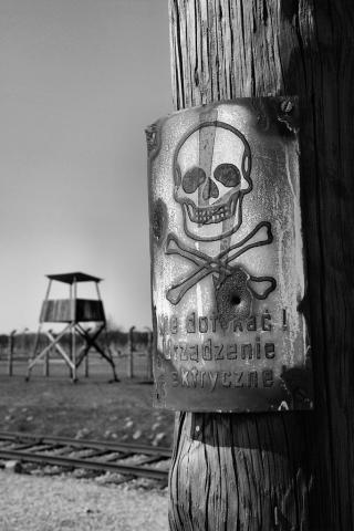 Concentration camp AUSCHWITZ BIRKENAU fences achtung minen skull metal sign