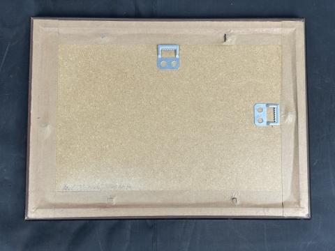 Zyklon B canister label in frame with holocaust photo Concentration Camp