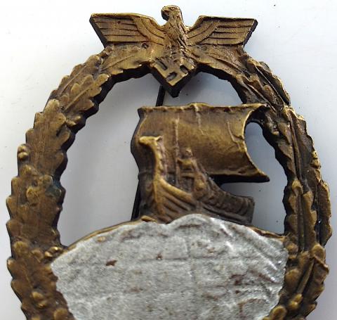 WW2 GERMAN NAZI VERY RARE KRIEGSMARINE AUXILIARY CRUISER BADGE IN BRONZE - MAKER MARKED ON THE BACK 