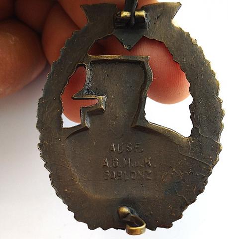 WW2 GERMAN NAZI VERY RARE KRIEGSMARINE AUXILIARY CRUISER BADGE IN BRONZE - MAKER MARKED ON THE BACK 