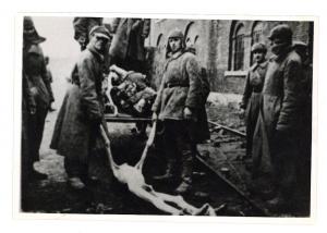 Holocaust shoking photos of extermination in concentration camp - ORIGINAL liberation picture showing pick up of corpes in Deblin